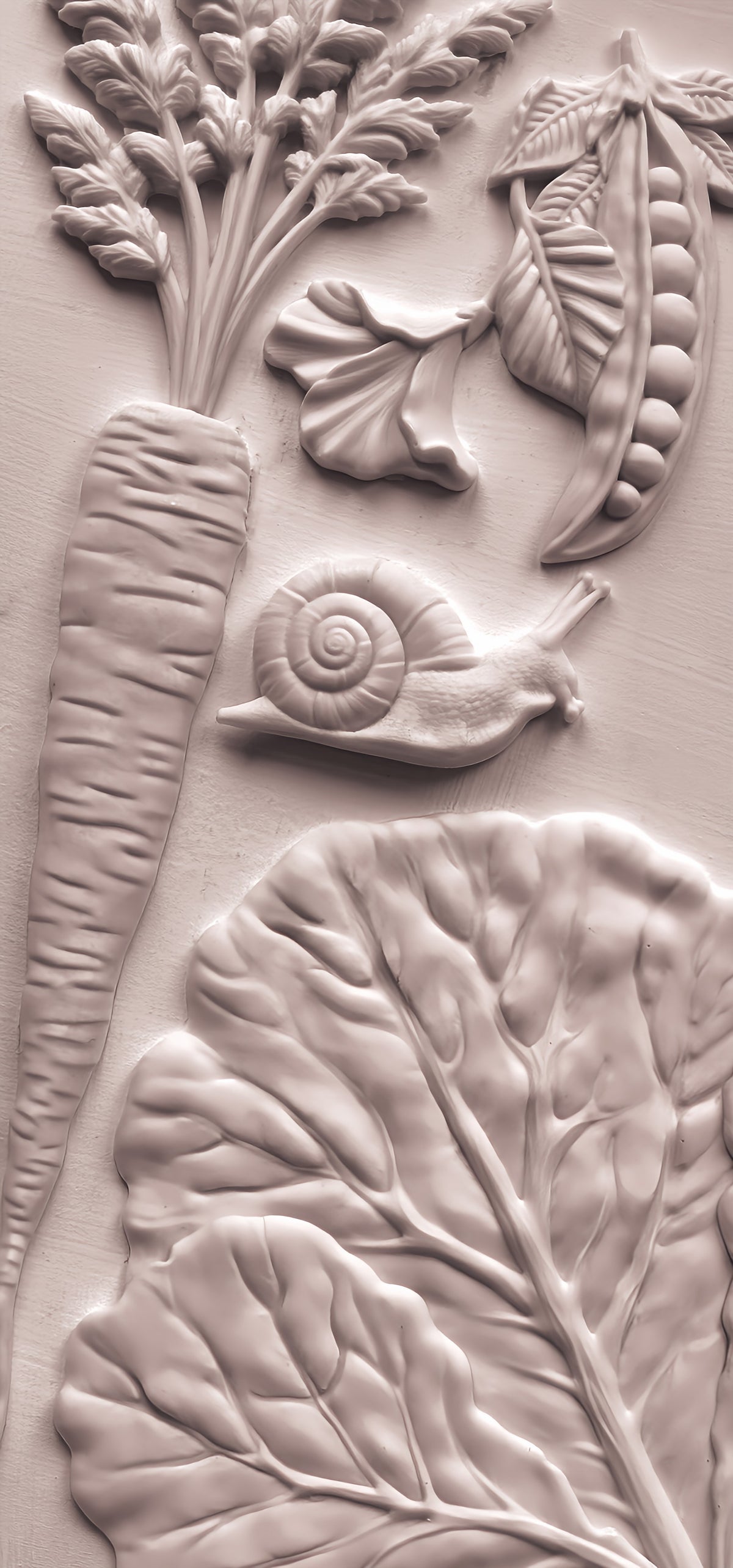 Carrot, pea pod, greens, and snail relief inspired by Spring Garden Mould by Iron Orchid Designs (IOD).