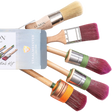 Five Staalmeester paintbrushes next to a Painter’s Essential Kit Box Gift Set.
