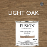 Fusion Mineral Paint Stain & Finishing Oil - All In One, Light Oak, displayed with a wood sample background.