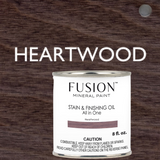Fusion Mineral Paint Stain & Finishing Oil All In One in Heartwood shown against a labeled wood background.