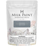 Homestead House Steel Blue Milk Paint 50g pouch with rustic design and health warning label visible.
