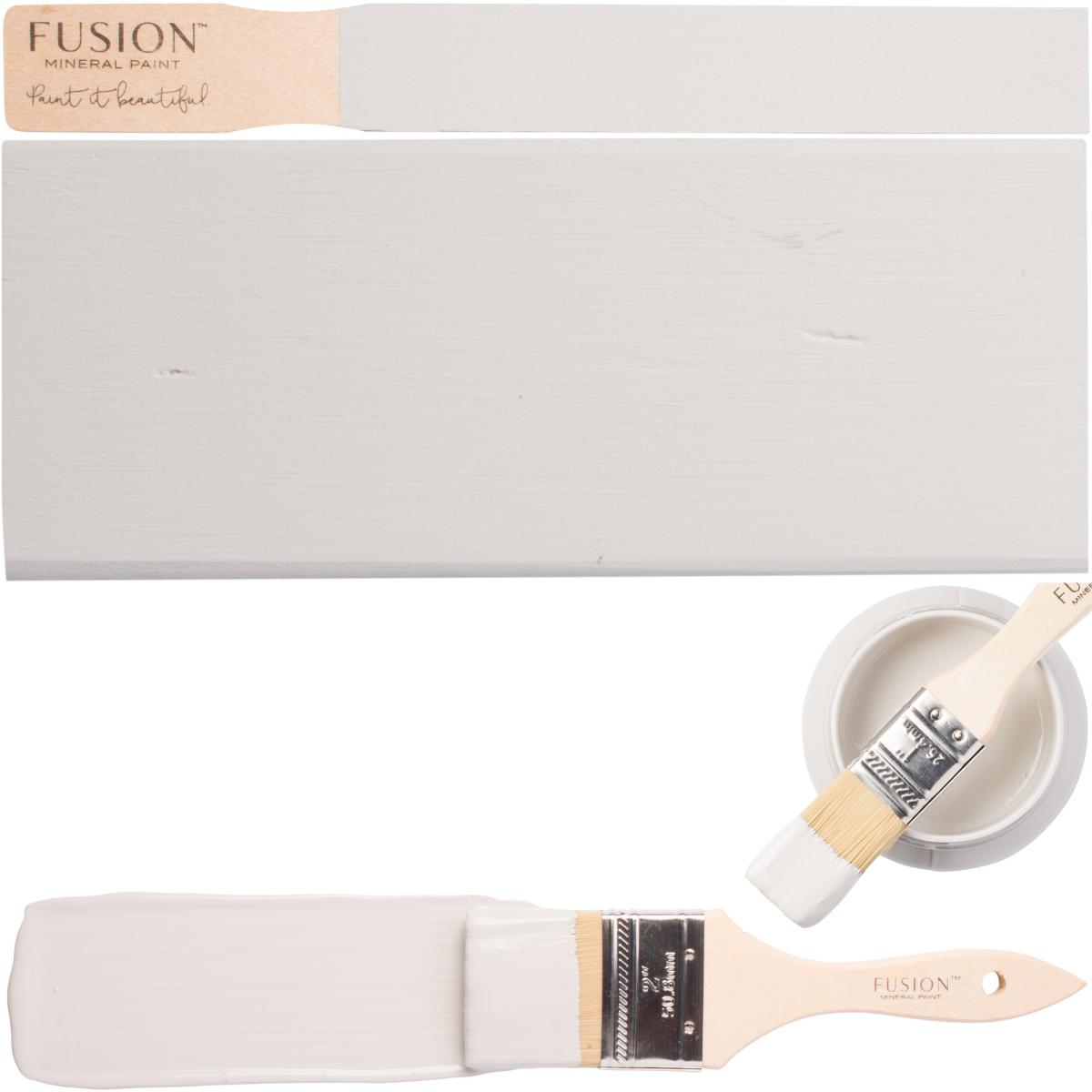 Paintbrush, wood sample, and open Sterling Fusion Mineral Paint container in matte finish.