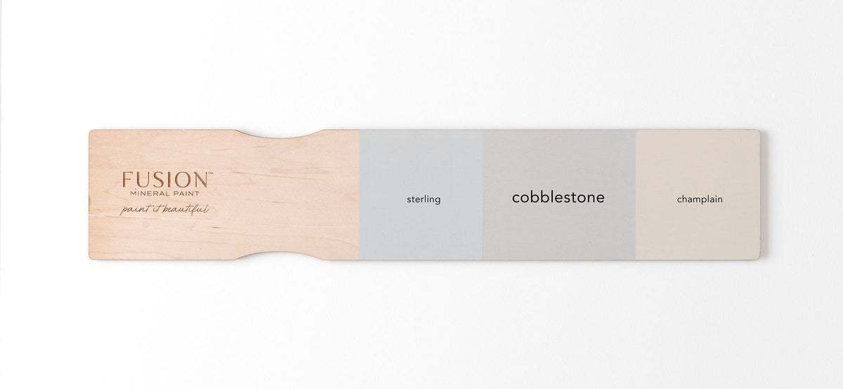 Sterling Fusion Mineral Paint, Cobblestone, and Champlain matte finish samples on a wooden board.