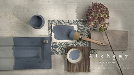 Alchemy by Fusion Digital Downloads with dried flowers, a brush, fabric swatch, and paint samples on white background.