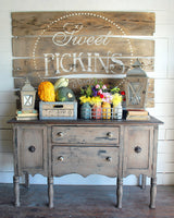 Rustic sideboard with fall decor beneath Suitcase – Sweet Pickins Milk Paint sign by Old Fashioned Milk Paint.