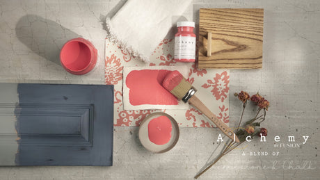 Sunset Alchemy Paint by Fusion Mineral Paint swatch, brush, fabric, and wood sample on textured surface.