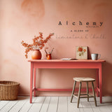 Desk painted with Sunset Alchemy by Fusion Mineral Paint, with orange flowers, mug, basket, and stool nearby.