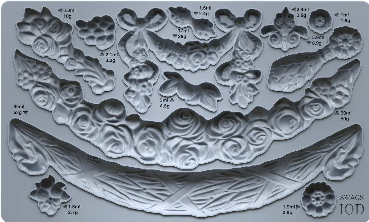 I.O.D. Swags Mould by Iron Orchid Designs, featuring ornate floral and ribbon shapes, labeled in ml and g.