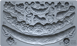 I.O.D. Swags Mould by Iron Orchid Designs, featuring ornate floral and ribbon shapes, labeled in ml and g.