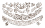 White appliques made with I.O.D. Swags Mould by Iron Orchid Designs, featuring flower, bow, and garland motifs.