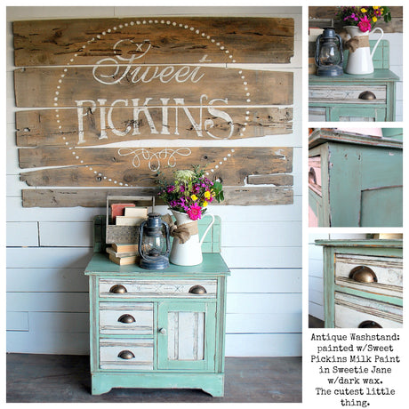 Teal and white washstand painted with Sweetie Jane holds flowers, books, and rustic wall art.