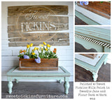 Sweetie Jane coffee table in light green Old Fashioned Milk Paint with carved trim and floral box decor, watermark visible.