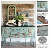 Distressed turquoise sideboard in Sweetie Jane by Old Fashioned Milk Paint, with vintage decor and a rocking horse.