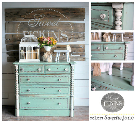 Mint green dresser painted with Sweetie Jane by Old Fashioned Milk Paint, topped with decor, flowers, and a birdcage.