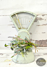 Vintage kitchen scale with faux flowers on wood painted in Old Fashioned Milk Paint Sweet Pickins by Sweetwater.