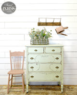 Pale green Sweetwater dresser by Old Fashioned Milk Paint next to a pink chair.
