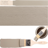 DIY paintbrush, taupe wooden plank, and Fusion Mineral Paint Tapestry shade shown together for color reference.