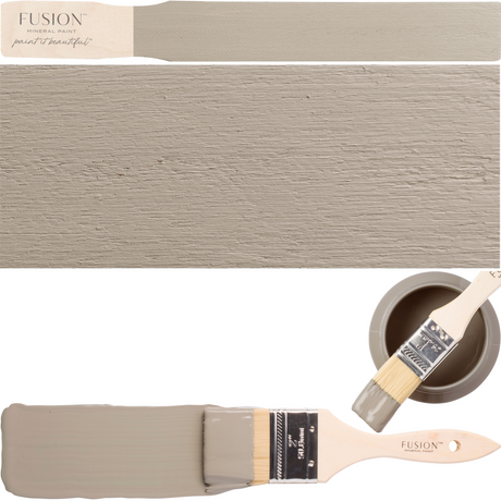 DIY paintbrush, taupe wooden plank, and Fusion Mineral Paint Tapestry shade shown together for color reference.