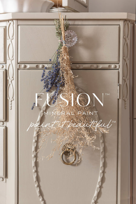 Beige cabinet with ornate detailing, ring handle, dried lavender, painted in Tapestry Fusion Mineral Paint.