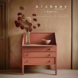 Dresser painted with Fusion Mineral Paint in Terracotta Alchemy, styled with bowl and dried flowers in a vase.