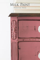 Distressed pink dresser with ornate details, finished with Homestead House Texas Rose Milk Paint.