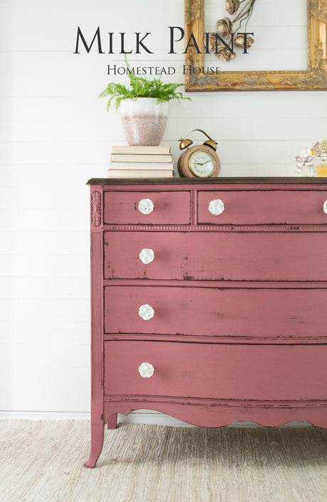 Pink dresser in Texas Rose Milk Paint by Homestead House with white knobs.