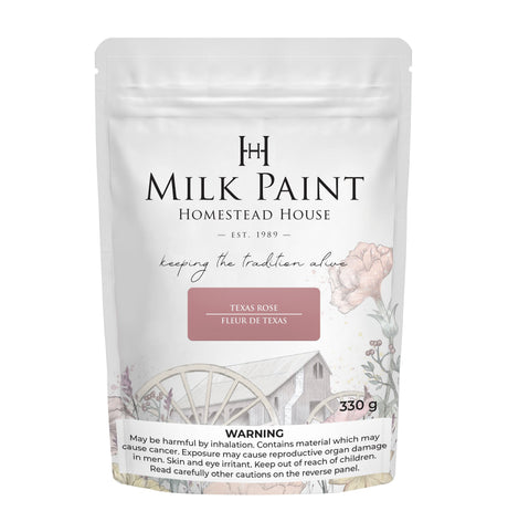 330g Texas Rose Milk Paint by Homestead House, bag features floral wagon art and visible safety warning label.