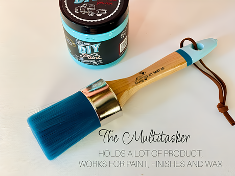 The Multitasker DIY Paintbrush by Debi’s Design Diary beside blue DIY Paint Co. paint on a white surface.