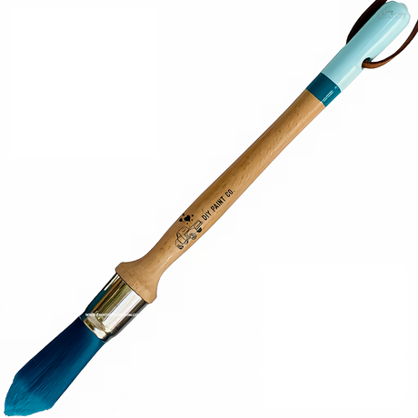 The Perfectionist DIY Paintbrush by DIY Paint Co. with ultra-soft bristles, blue tip, wood handle, and small DIY logo.