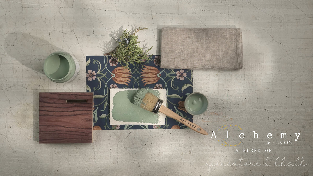 Alchemy by Fusion Digital Downloads, a brush, and Fusion Mineral Paint arranged on a cracked surface.