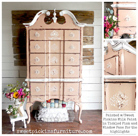 Ornate dresser painted Tickled Pink by Old Fashioned Milk Paint with floral accents, surrounded by flowers and yarn.
