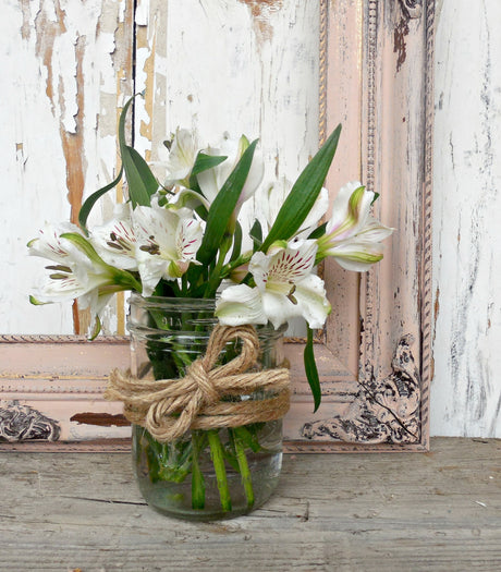 White lilies in a jar on rustic wood, with Tickled Pink – Sweet Pickins Milk Paint by Old Fashioned Milk Paint frame.