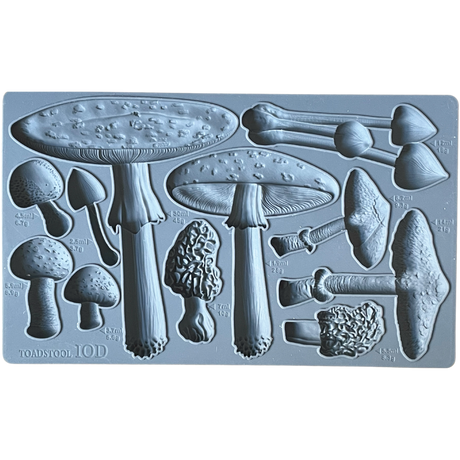 IOD Toadstool Mould with assorted mushroom shapes, each marked with milliliter measurements. Brand: I.O.D.