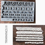 Trimmings 3 Mould by I.O.D. featuring six ornate silicone trim designs displayed on a white background.