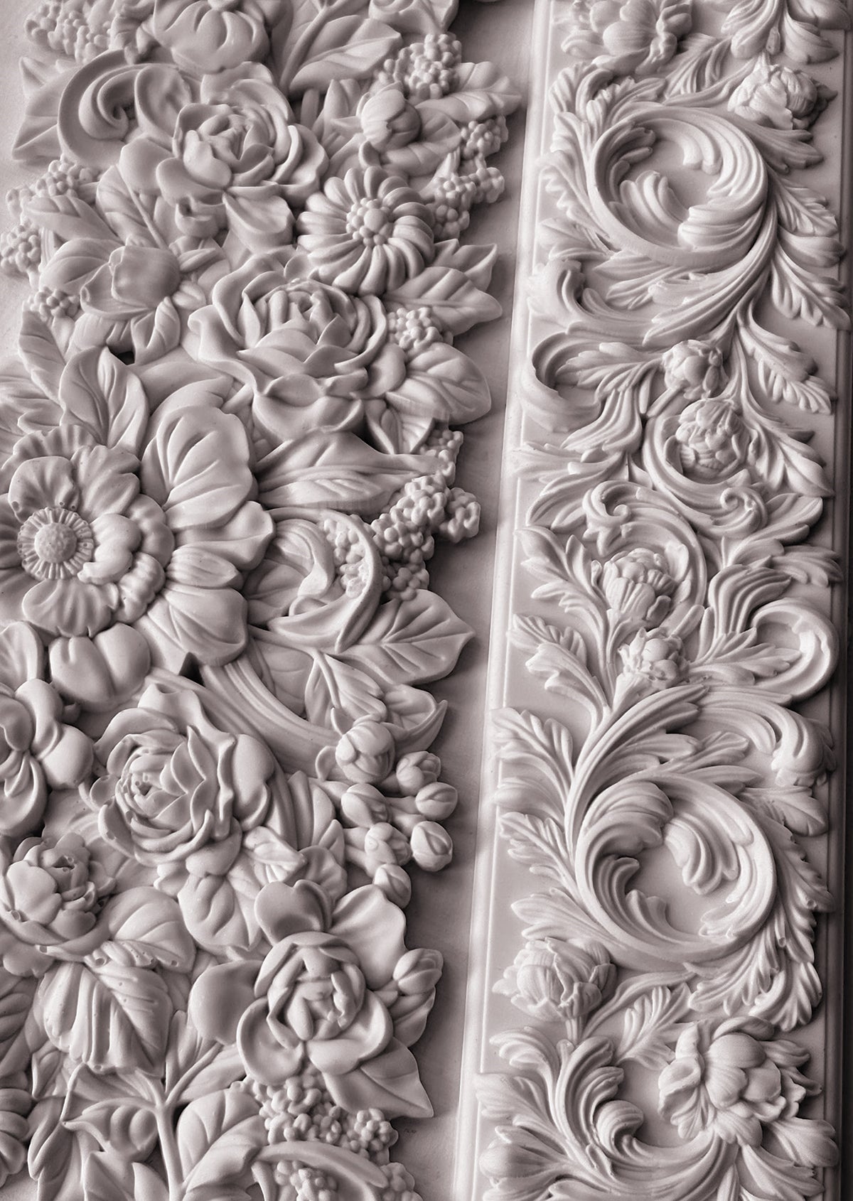 I.O.D. Trimmings 4 Mould floral and leaf reliefs in monochrome style on a wall.
