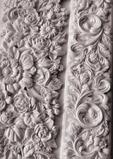 I.O.D. Trimmings 4 Mould floral and leaf reliefs in monochrome style on a wall.