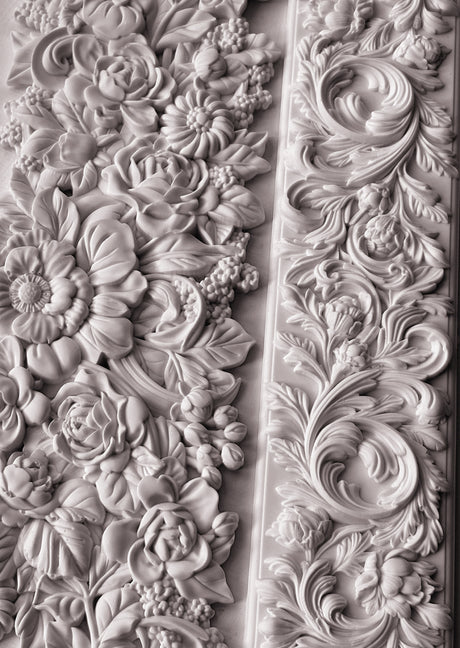 I.O.D. Trimmings 4 Mould floral and leaf reliefs in monochrome style on a wall.