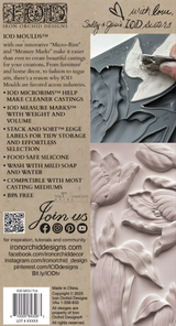 Hand pressing I.O.D. Tulips Mould against gray, white, and mauve swirled patterns.