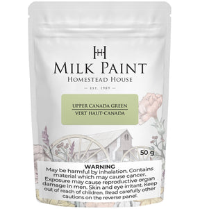 Homestead House Upper Canada Green Milk Paint 50g pouch with warning label and floral design.