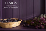 Wicker basket with dark plums and dried flowers next to Velvet Plum Fusion Mineral Paint by Fusion Mineral Paint.