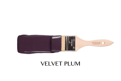 Paintbrush with Fusion Mineral Paint in Velvet Plum.