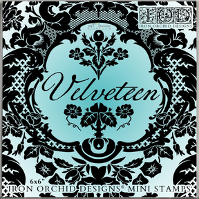 Black floral frame on blue with “Velveteen” text, made using I.O.D. Velveteen Mini-Stamp and damask accents.