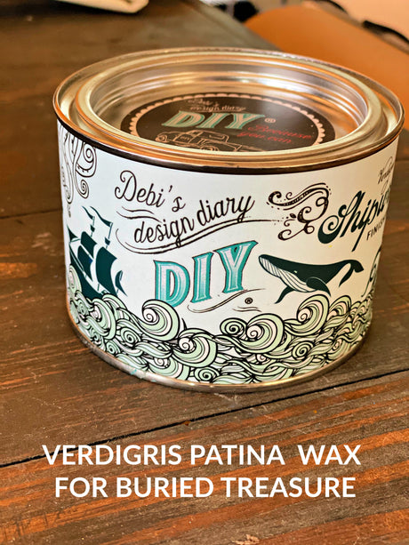 DIY Paint Co. Verdigris Shipwrecked DIY Wax can with teal label on wood surface.