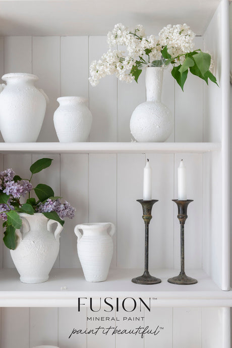 White vases, flowers, and brass candlesticks on Fusion Mineral Paint Victorian Lace layered white background.