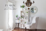 White armchair and vases in a room with wood floors, walls painted Fusion Mineral Paint Victorian Lace.