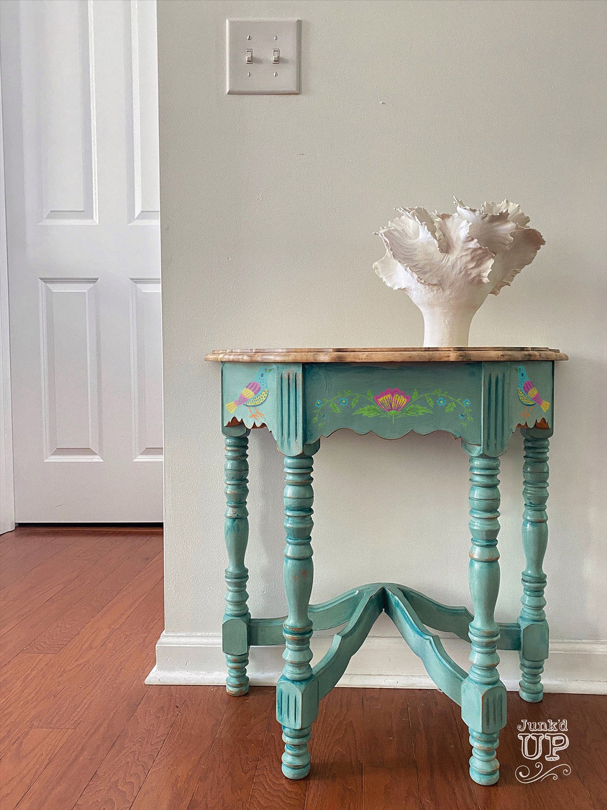 Small blue vintage table with I.O.D. Vida Flora Paint Inlay, shown with a white decor piece.