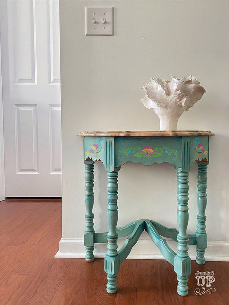 Small blue vintage table with I.O.D. Vida Flora Paint Inlay, shown with a white decor piece.