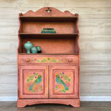 Wood cabinet featuring IOD Vida Flora Paint Inlay by Debi Beard with shelves and bird and flower doors by I.O.D.