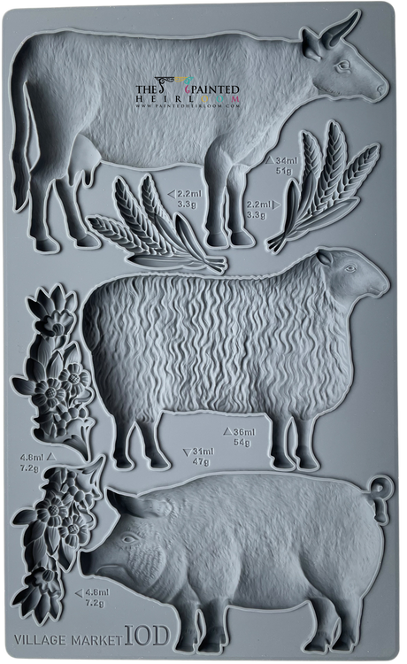 Village Market Mould by IOD, gray silicone tray with cow, sheep, pig, and plant shapes labeled by volume and weight.