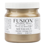 250mL jar of Fusion Mineral Paint in Vintage Gold with mica pigments, white lid, and branded label.